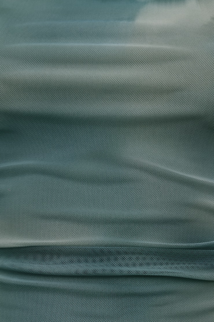 Haut licou drapé en maille