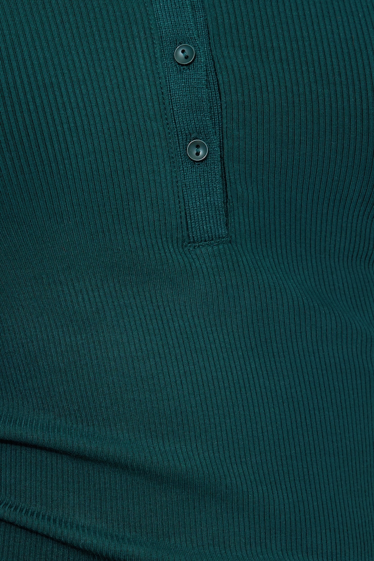 Haut polo côtelé à manches longues